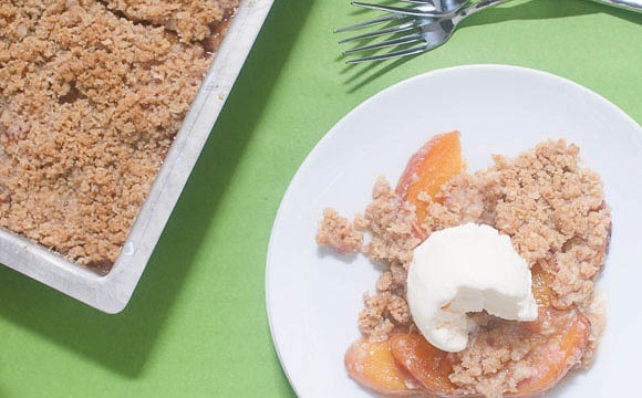 Peach Crisp served warm with some vanilla ice cream. Yummy! #GlutenFreeBaking #DessertRecipes #peaches